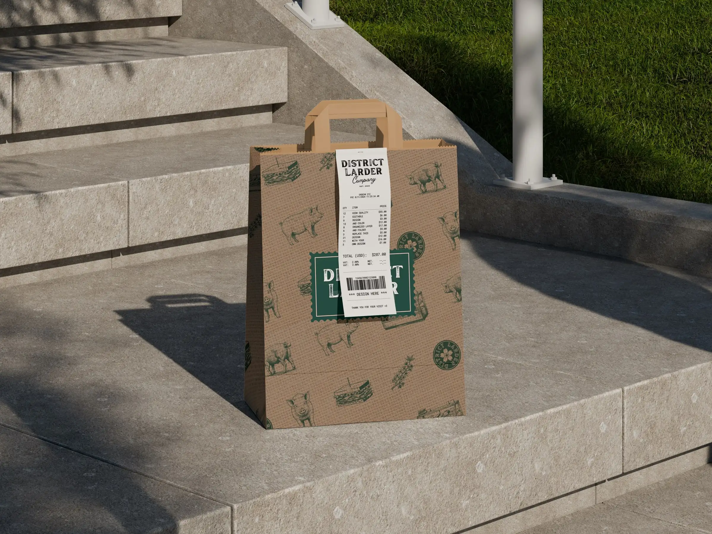 A kraft paper bag printed with District Larder’s pig and sandwich pattern, a receipt tucked into its handle, on stone steps