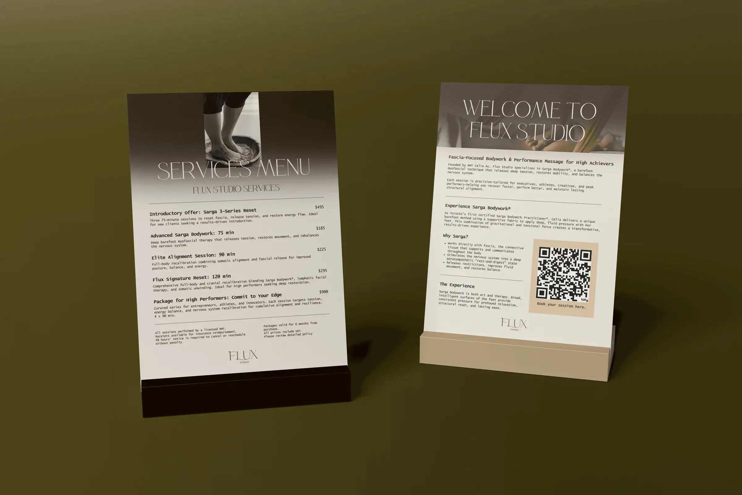 Flux Studio table signs: a services menu and a “Welcome to Flux Studio” card with a booking QR code